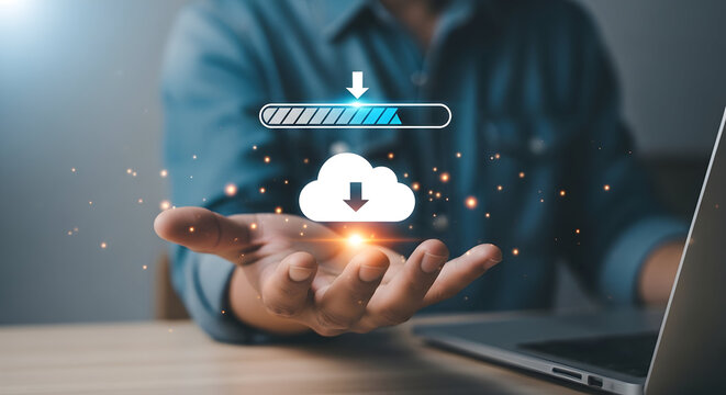 Person using laptop to download files from cloud storage with progress bar indicating completion status - Powered by Adobe