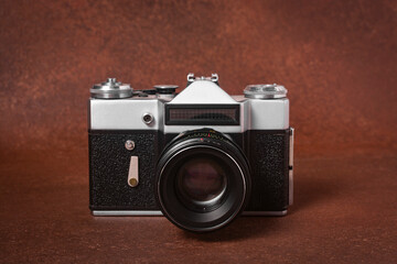 vintage film camera on a brown background