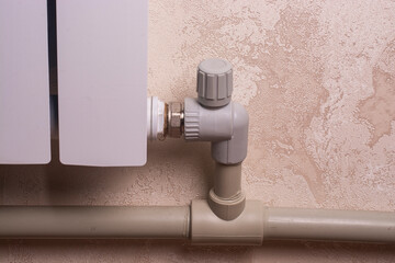 close-up of a tap connected to a heating radiator.