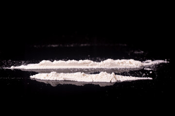 Close-up of cocaine lines on a black background