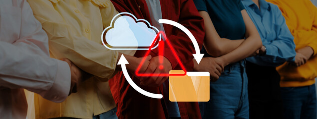 A diverse group of individuals stands united with cloud storage and warning icons, reflecting the importance of teamwork in ensuring data security and technology innovation. Gantry