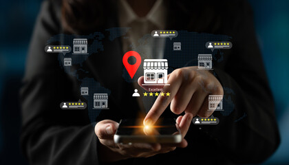 A professional woman interacts with a smartphone displaying a digital map with a location marker and star ratings, emphasizing business reviews and user engagement. Gantry