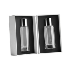 Two elegant perfume bottles in gift boxes