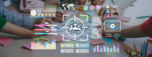 Diverse group of individuals collaborating in a modern workspace, using digital tools and colorful notes to brainstorm ideas and visualize data for effective communication and strategy. Gantry