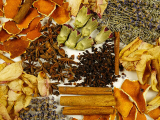 Dried herbs, flowers, spice, orange peels, top view, background. Ingredients for air freshening and relaxation.