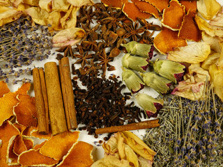 Dried herbs, flowers, spice, orange peels, top view, background. Ingredients for air freshening and relaxation.
 