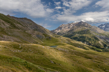 Naklejka premium Panoramic mountain view of the Arves Massif with the Lac du Pontet in the French Alps