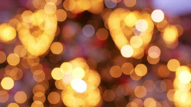 A soft, abstract cluster of golden bokeh lights creates a warm, festive atmosphere perfect for holiday, celebration, and seasonal design projects. Ideal background for greeting cards, banners, and moo