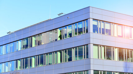 Modern facade of glass building. A modern contemporary office building with glass facade on a sunny day no people.