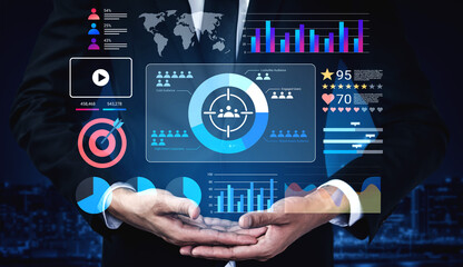 A businessman in a suit showcases digital analytics with colorful charts, graphs, and world data highlights in a modern office setting, symbolizing progress. Gantry