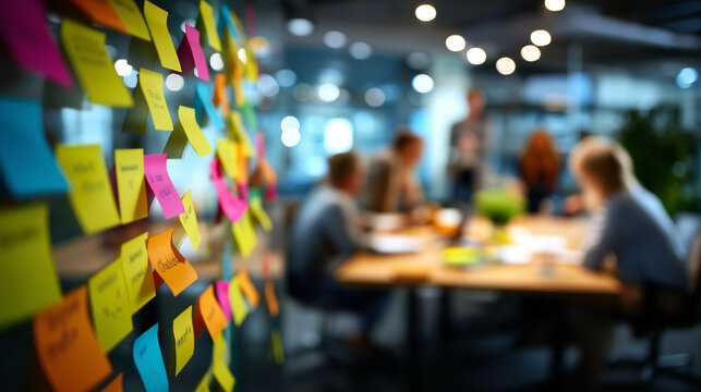 Defocused team brainstorming session, blurred creative collaboration, ideation meeting atmosphere, with copy space
