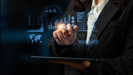 A business professional engages with advanced data visualization on a tablet screen, showcasing graphs and analytics in a contemporary office environment. Scalp