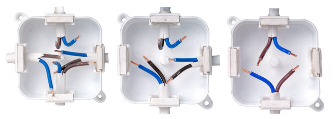 Small plastic electrical box in the wall for electrical cables, isolated background. Three cable routing options.