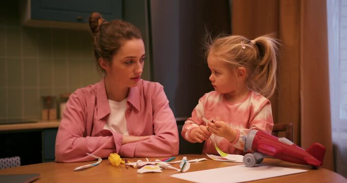 Tired mother showing signs of exhaustion and stress