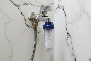 Installing washing machine water filter