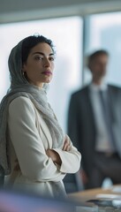 Confident Middle Eastern professional embodies leadership in a modern corporate office setting