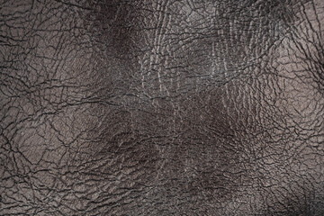 Dark brown wrinkled leather texture surface