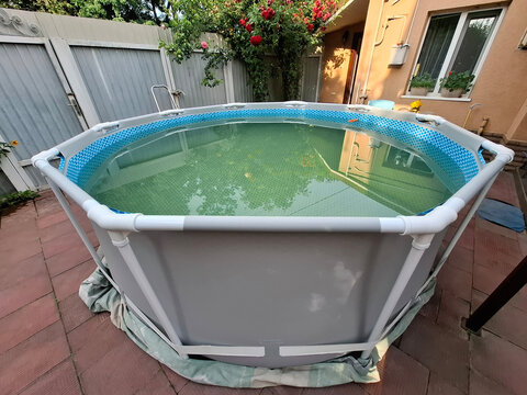 Outdoor man-made swimming frame pool in the yard