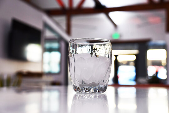 Glass of Ice on Bar Top
