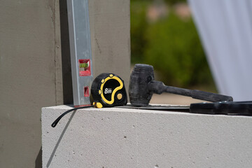 The bricklayer is working. Building a wall of aerated concrete. Gasbeton wall