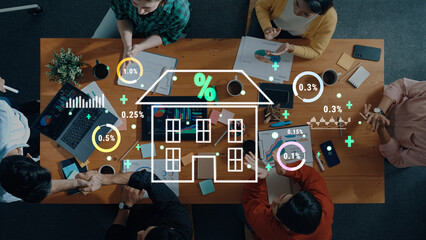 A diverse team collaborates on real estate market analysis, surrounded by laptops and documents, with visual data charts illustrating growth and insights. Trope