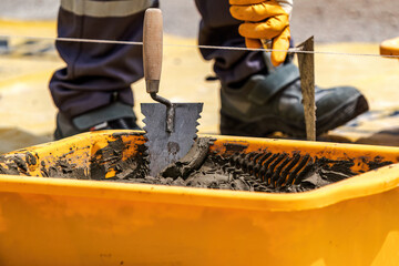 The bricklayer is working. Building a wall of aerated concrete. Gasbeton wall