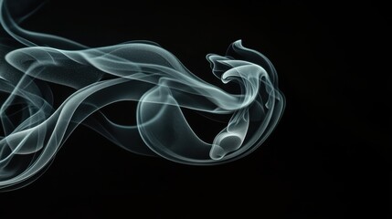 Abstract swirl of grey smoke moving gracefully against a stark black background