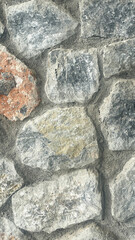 Fototapeta premium Natural Stone Wall Texture With Rough Rocks And Cement Joints, Close Up Of Rustic Masonry Surface For Exterior Or Interior Design, Construction, Architecture And Background Use