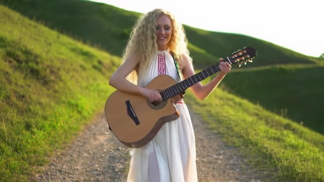 A radiant young caucasian woman with long blonde hair, in a flowing white dress, gracefully dances and mimes guitar on a sunlit dirt path amidst rolling hills. Concept of unbridled joy and freedom