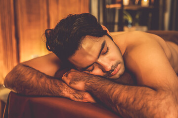 Caucasian man customer enjoying relaxing anti-stress spa massage and pampering with beauty skin...