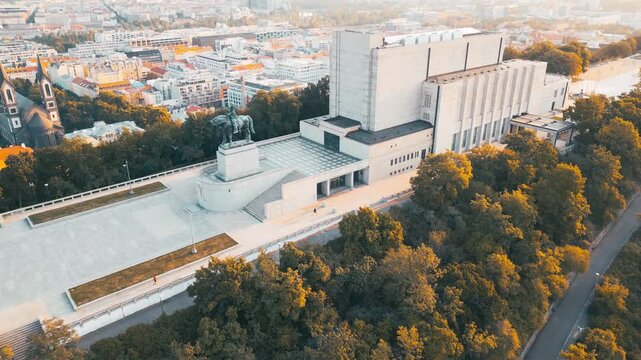 Witness the stunning sunrise over the National Monument at Vitkov Hill in Prague.