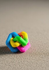 Highly detailed tiny scene featuring a colorful structure resting on a textured surface, emphasizing small scale and precise craftsmanship, fun, architecture, toy