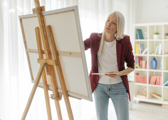 Female artist painting on an easel