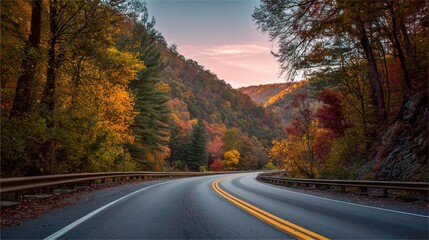 Obraz premium Autumnal mountain road winding through vibrant foliage