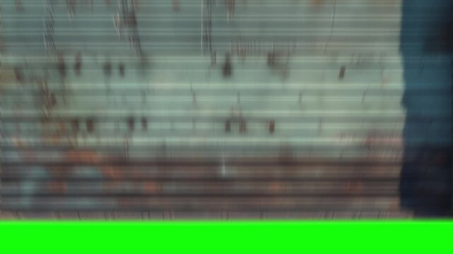 Garage metal shutter door rolling transition on green screen background