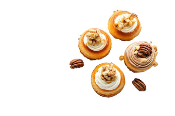 top view assorted Choux cake with topping French dessert French shu cake with nuts and cream on a dessert white plate isolated on white background.jpeg