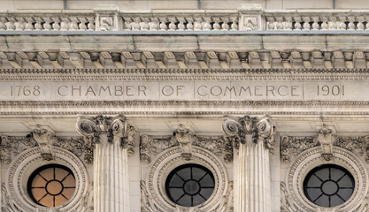 Chamber of Commerce building facade near Wall Street in Manhattan, New York City, United States of America.  Famous American financial institution.