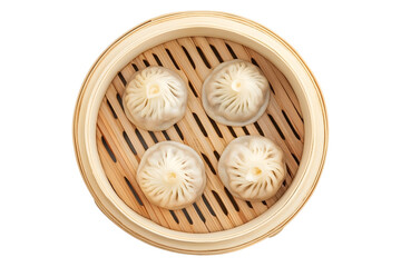 Steamed baozi dumplings stuffed with meat in a bamboo steamer Isolated white background Top view