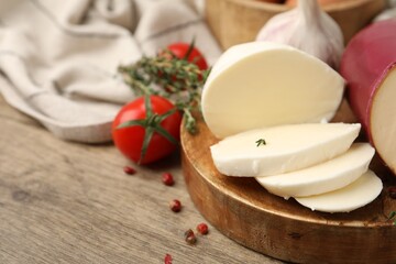 Fototapeta premium Different fresh dairy products served on wooden table, closeup. Space for text