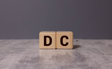 Wooden blocks arranged as an upward graph with data point circles labeled C D