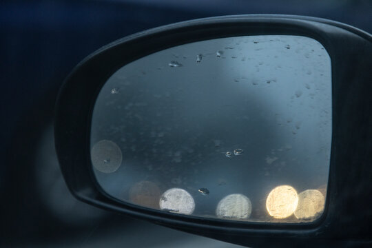 Mirror of car reflects fog
