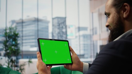 Smart businessman in office makes business projections next to copy space, reviews profitability reports and executes investment strategies for sustained corporate growth. Success story. Camera A.