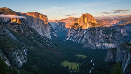 Naklejka premium Sunset over mountain landscape with golden light reflecting on valley