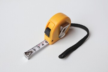 yellow measuring tool on white background