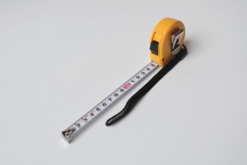 yellow measuring tool on white background