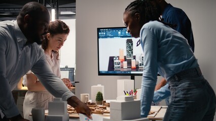 Team of real estate developers planning modern residential project, ensuring 3D models and market insights to prepare for site development and zoning regulations approval. Property investment.