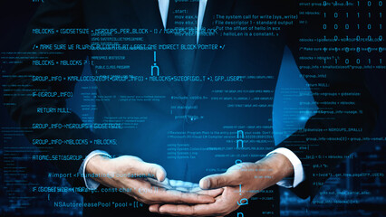 A businessman in a suit holds a digital interface displaying code, symbolizing technology and cyber security progress in a modern office environment. Xenic