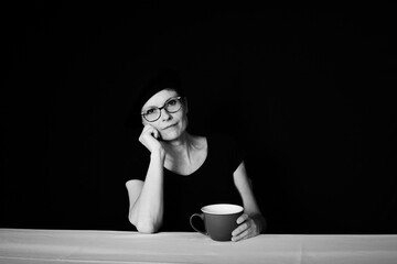 Approachable businesswoman representing positive leadership during coffee break