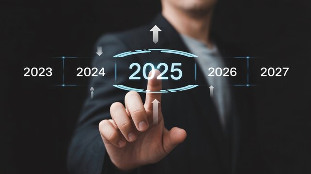 Businessman touching futuristic interface with 2025 highlighted in blue glow on dark background for corporate technology - Powered by Adobe
