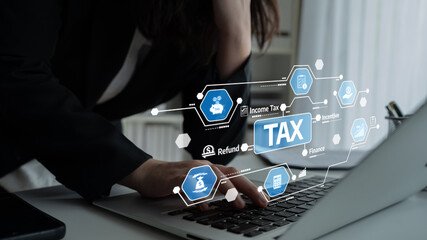A professional working on a laptop for tax planning with a digital interface showcasing various financial elements, emphasizing the refund process and management strategies. Tessel